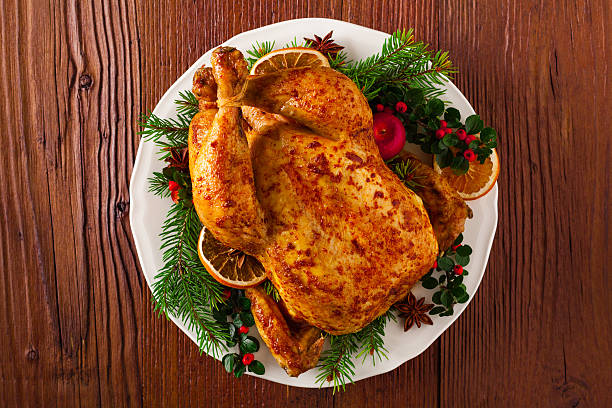 istock Roasted whole chicken with Christmas decoration. 617768260