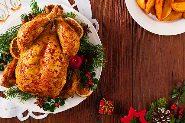 istock Roasted whole chicken with Christmas decoration. 617768392