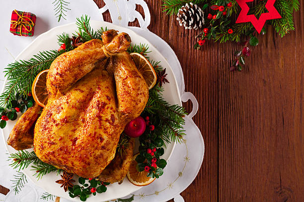 istock Roasted whole chicken with Christmas decoration. 617768518
