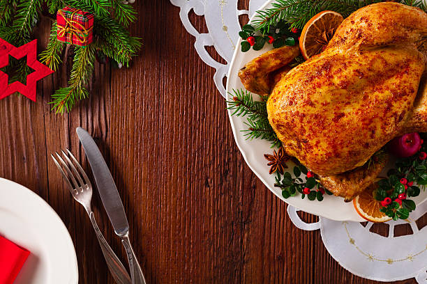 istock Roasted whole chicken with Christmas decoration. 617768646