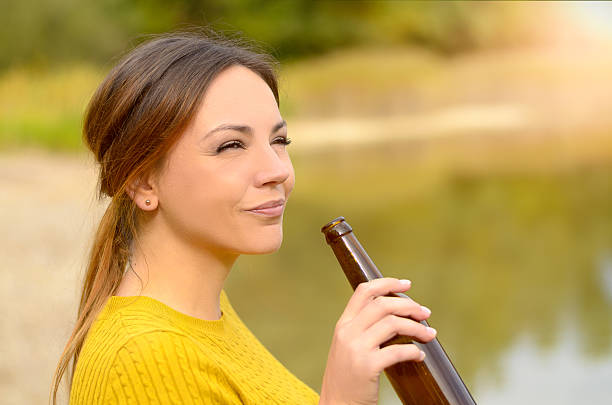 Young woman enjoying a relaxing beer