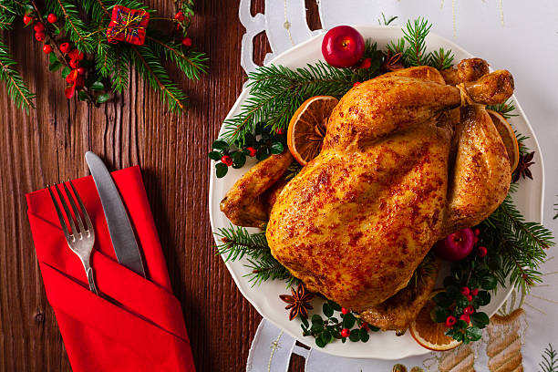 istock Roasted whole chicken with Christmas decoration. 617768878