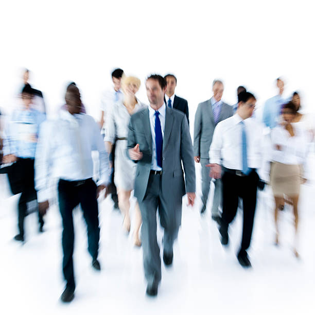 istock Large Group of Business People Walking 617768902