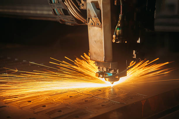 istock Laser cutting with sparks close up 617768910
