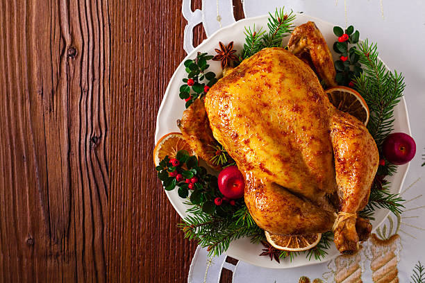 roasted whole chicken with christmas decoration. - christmas turkey imagens e fotografias de stock