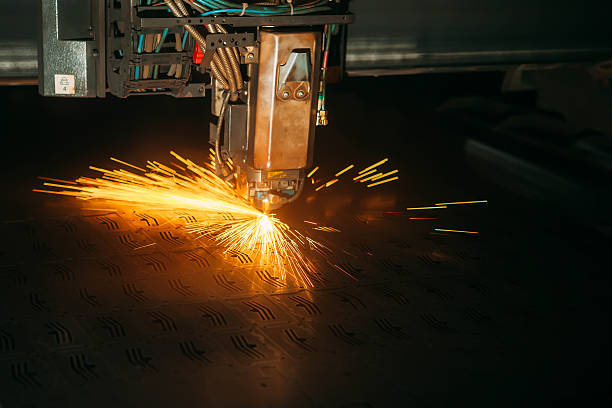 istock Laser cutting with sparks close up 617769024