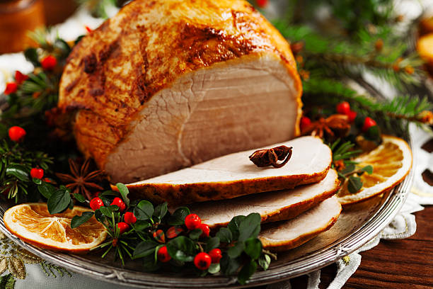 istock Christmas baked ham, served on the old plate. 617769122