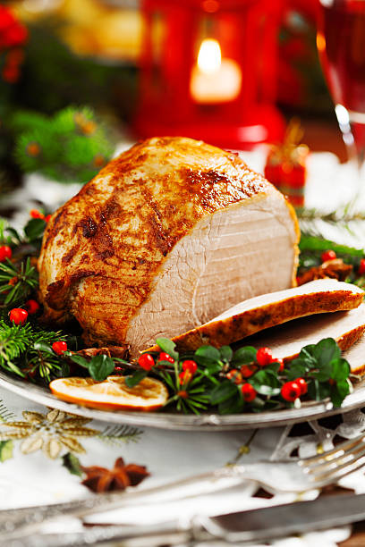 istock Christmas baked ham, served on the old plate. 617769210