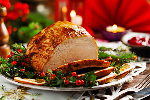 istock Christmas baked ham, served on the old plate. 617769376