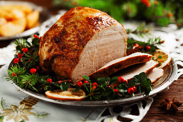 istock Christmas baked ham, served on the old plate. 617769436