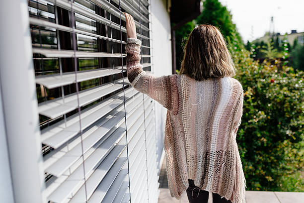 istock Woman in woolen sweater posing on terrace 617769996