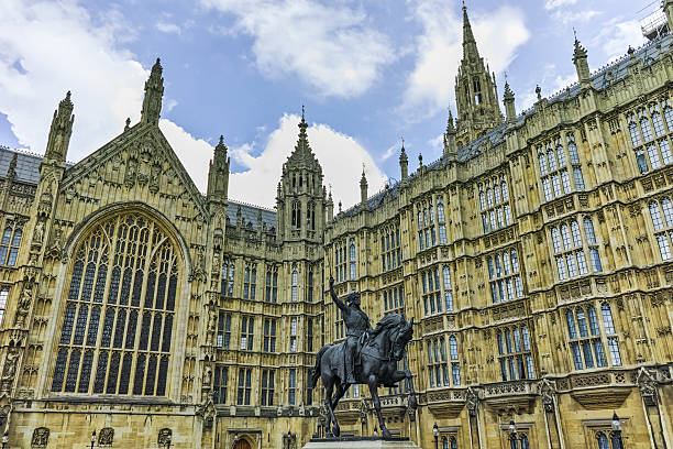 istock George V monument and Westminster Abbey, London, England 617770558