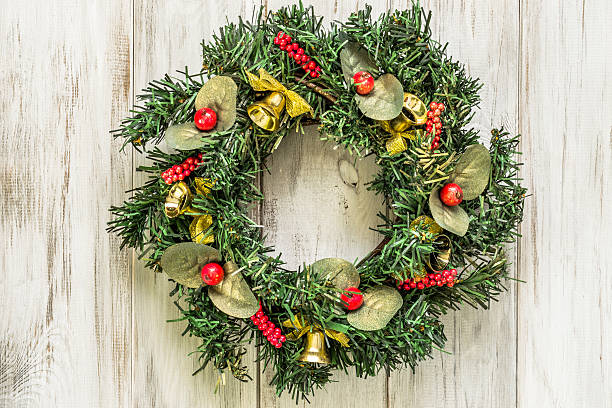 istock Advent wreath with Christmas decoration on white background 617770664