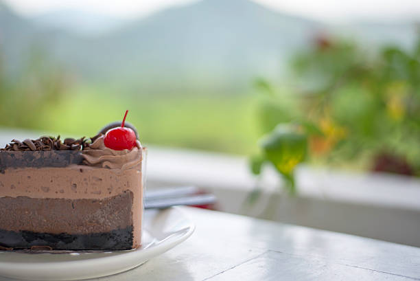istock Delicious chocolate cake on plate on table 617771176