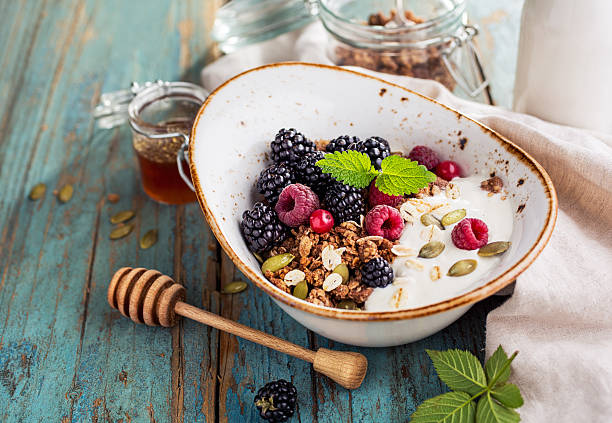 istock Delicious granola with blackberry, close-up 617776754
