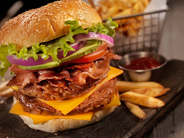 istock Avocado Bacon Cheeseburger with a Basket of Fries 617778910
