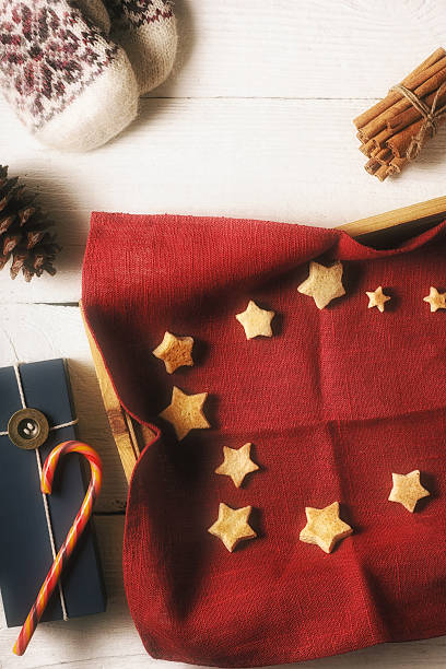 istock Christmas cookies on red napkin in tray  with accessorizes vertical 617864474