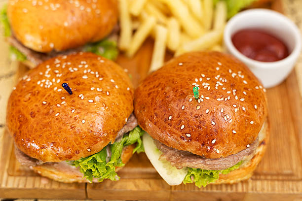istock burgers with fries 617864658