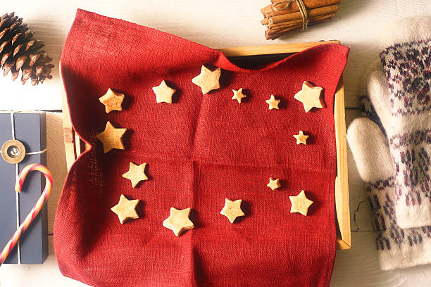 istock Christmas cookies on  red napkin in tray  with accessorizes 617864664