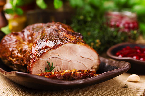 istock Roast pork with cranberry dip, basil, coriander and rosemary. 617865514