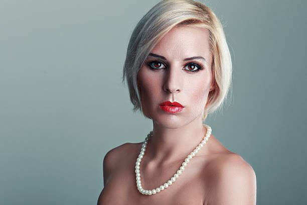 istock woman with a pearl necklace 617865570