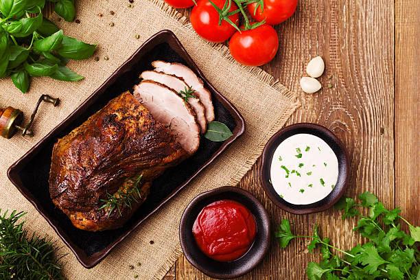 istock Roast pork with tomato dip, dip with garlic and herbs. 617865748