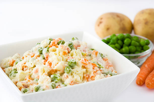 istock Traditional russian salad on white background 617868758