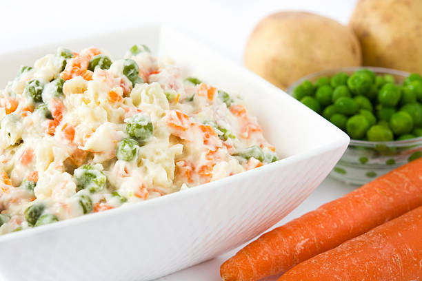 istock Traditional russian salad on white background 617868856