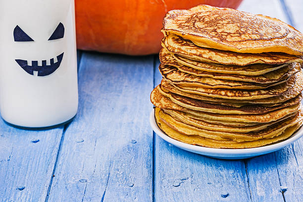 istock Pumpkin pancakes and boo milk bottle 617869360