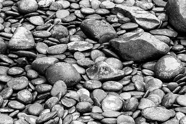Close up view of smooth polished multicoloured stones decorate in the park - monochrome style pictures