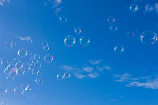 Bubble wand in blue sky