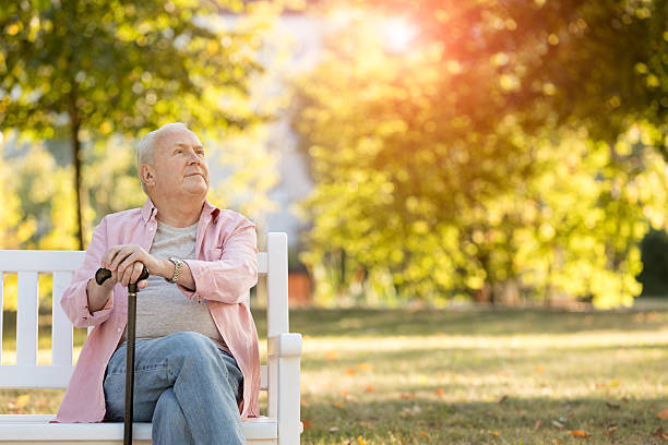 Senior man sitting on bench outdoors