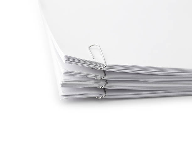 istock Close up of a stack of papers and paper clip 617873148