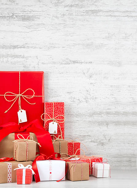 istock Christmas Gift Boxes on Wooden Background 617873336