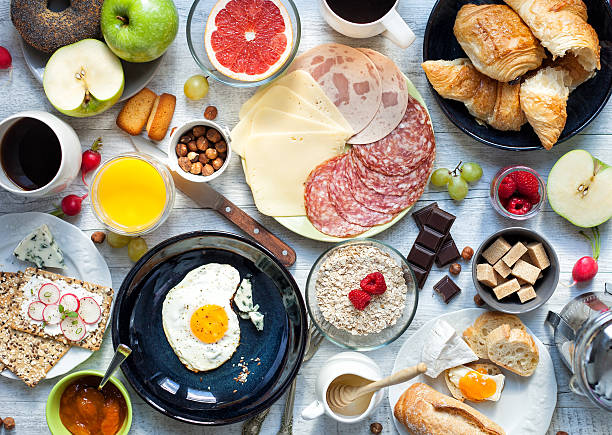 Big breakfast on the white rustic table. stock photo