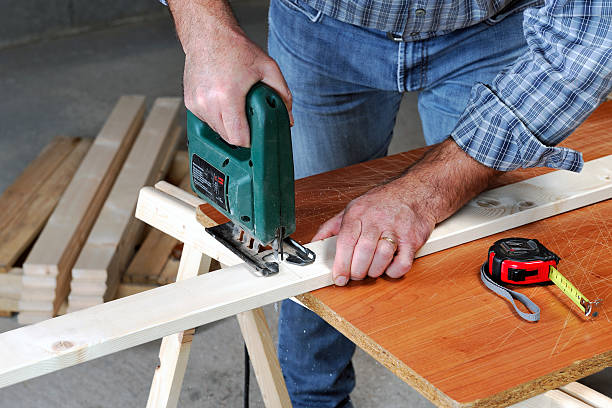 istock Carpenter at work on the wood. 617876940