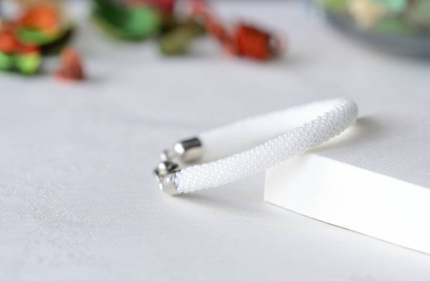 istock White beaded crocheted bracelet close up 617877050