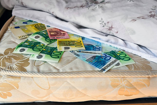 istock Euro cash safely kept under bedsheet 617878928