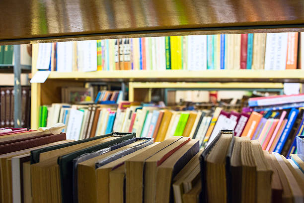istock Books on the shelves in the library 617879414