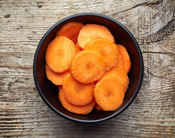 istock Bowl of sliced carrot, from above 617879686