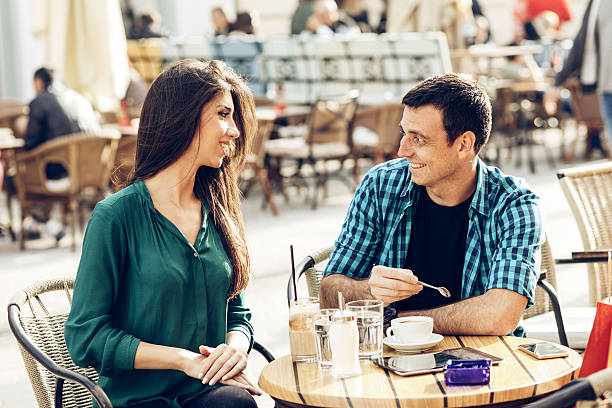 istock Young couple enjoying in coffee outdoor 617880262
