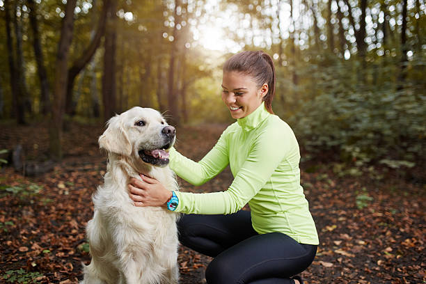istock Young sportswoman and her dog 617882976