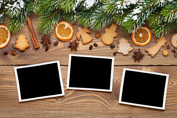 istock Christmas photo frames, tree, spices and cookies 617883386