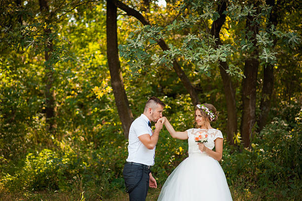 istock Bride and groom at wedding Day walking Outdoors 617885366