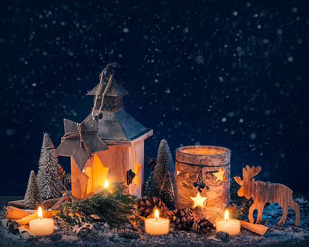 istock Burning lantern and christmas decoration 617887030