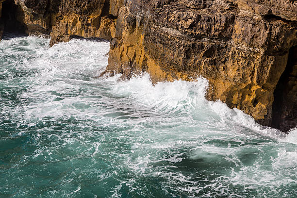 istock surf sea waves motion on rock 617892684