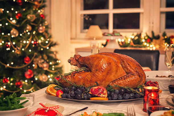 istock Traditional Stuffed Christmas Turkey with Side Dishes 617894360