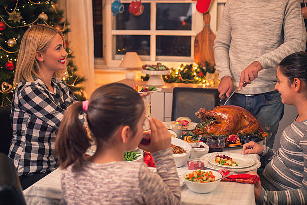 istock Carving Traditional Stuffed Turkey For Christmas 617895462