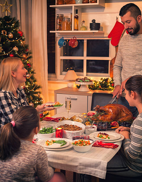istock Carving Traditional Stuffed Turkey For Christmas 617895652