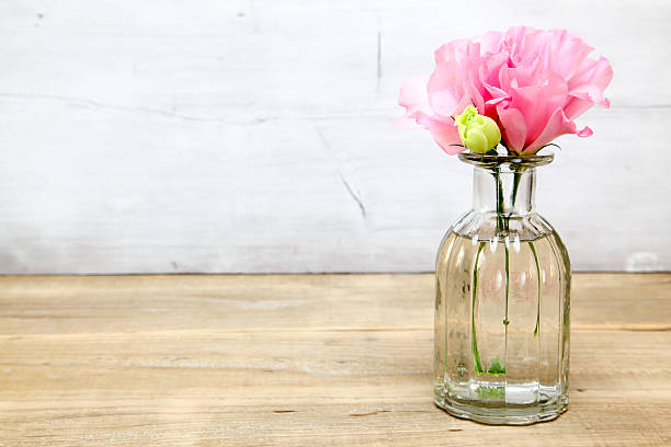 istock Eustoma in a glass vase 617895732